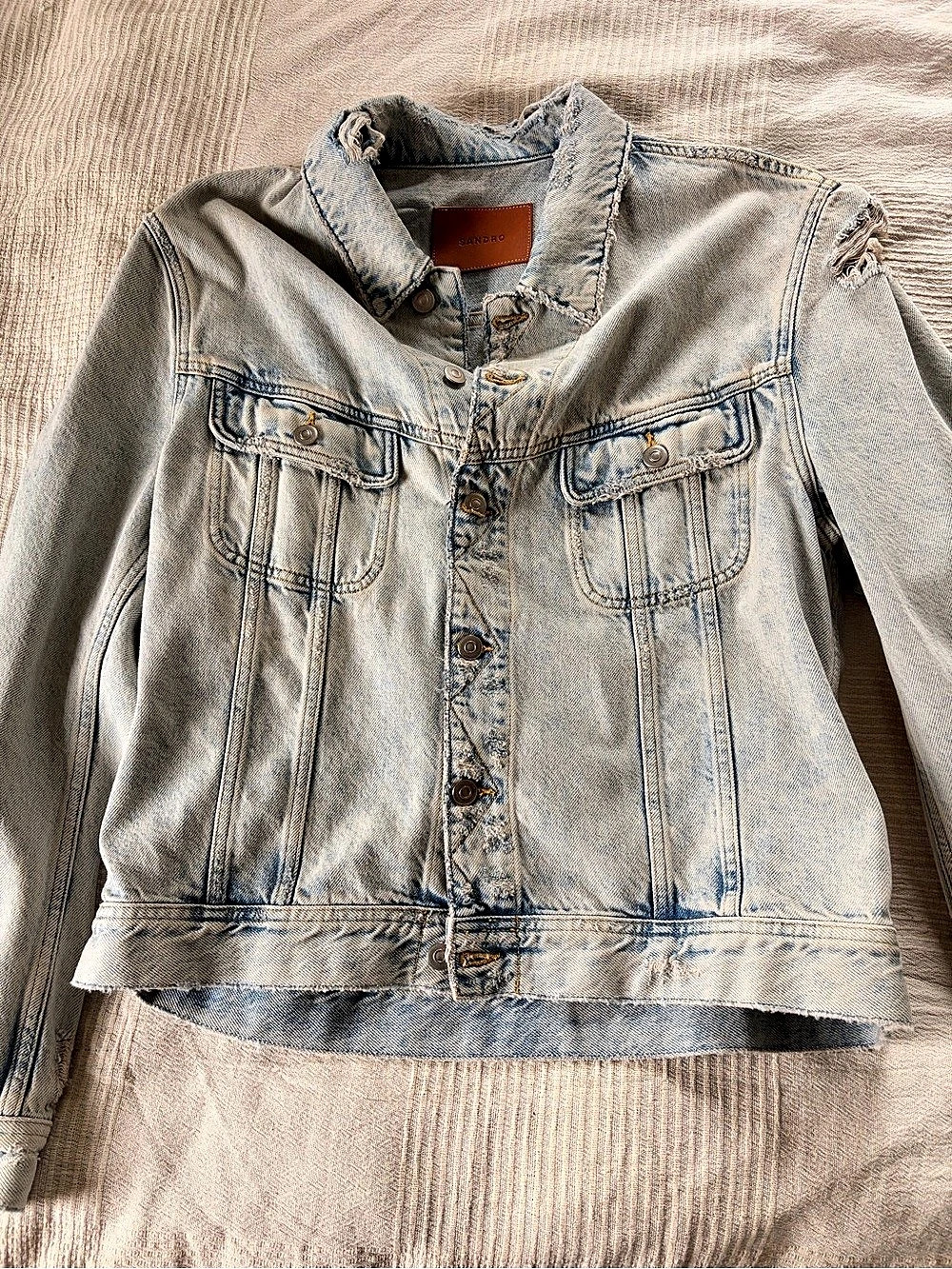 Sandro Distressed Light Wash Denim Trucker Jacket in Blue